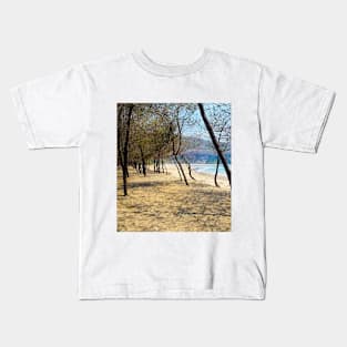 Pine tree forest at Pacitan beach with mountain in backround Kids T-Shirt